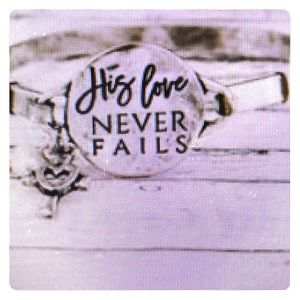Burnished Silvertone “His Love never Fails”